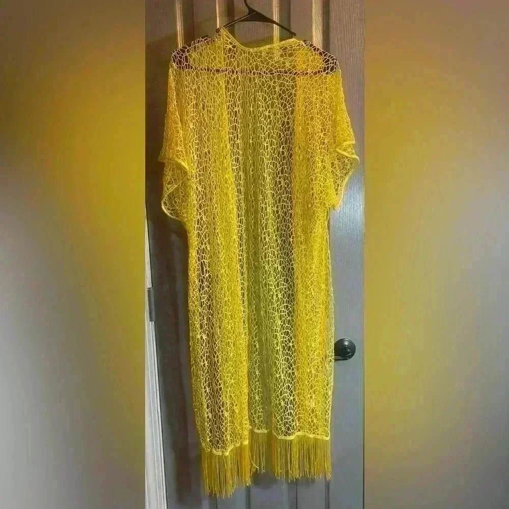 Yellow coverup for swimsuit or casual wear. Fits like a medium